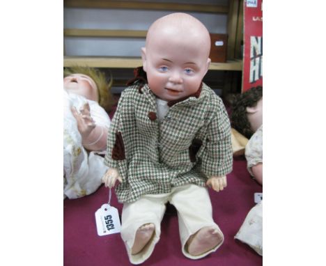 A Bisque Headed Boy Doll, German, leather body with composition limbs, 39cm high.