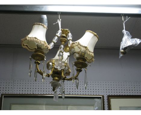 A Mid XX Century Ormolu Three Branch Ceiling Light, the acanthus moulded branches each hung with glass prismatic drops, centr