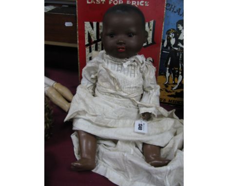A Bisque Headed Black Baby Doll, by Armand Marseilles, sleepy eyes, open mouth, composition body, 48cm high.