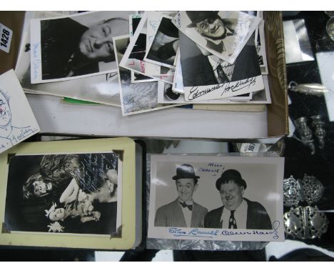 A Stan Laurel and Oliver Hardy signed Black and White Publicity Photocard, signed in blue ink and dedicated "Hello Charlie!";