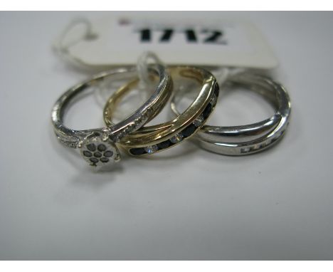 A Modern Diamond Set Ring, illusion set cluster to the centre, between inset shoulders, stamped "375"; a 9ct white gold chann