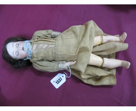 An Early XX Century German Bisque Headed Doll, sleepy eyes, open mouth with teeth, fully jointed composition body, 38cm high.