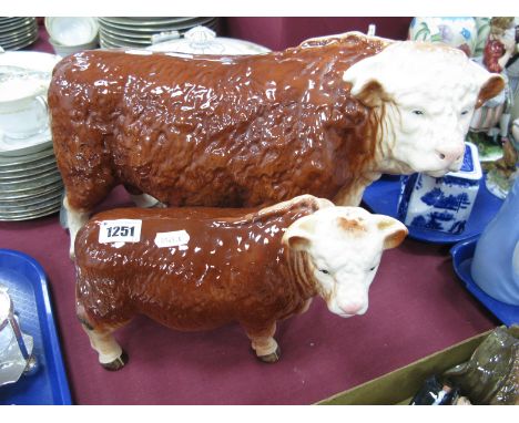 A Melba Pottery Hereford Bull and Calf.