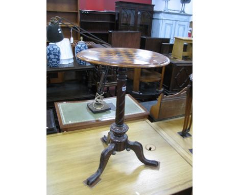 A XIX Century Mahogany Games Table, with a circular chess board top, moulded edge, on cabriole legs.