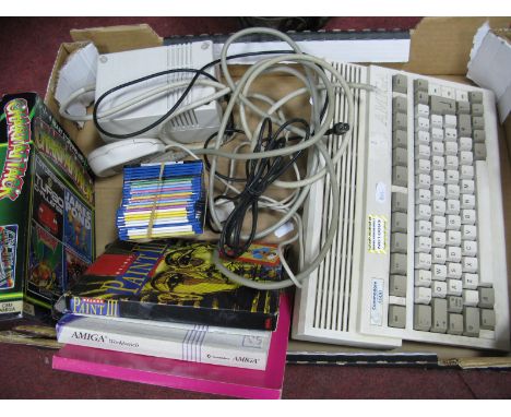 A Commodore A600 Amiga Games Console; together with various games, including Chart Attack:- One Box