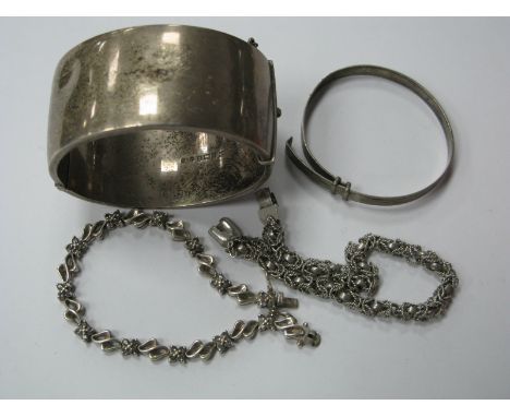 A Wide Hallmarked Silver Bangle, with part foliate design, (damages), another hallmarked silver expanding bangle, engraved to