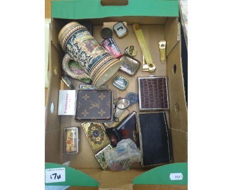 A mixed collection of items to include: small tin boxes, 1930's silver plate match box holder, needle tins etc 