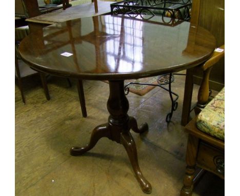 A mahogany pedestal tripod table: 