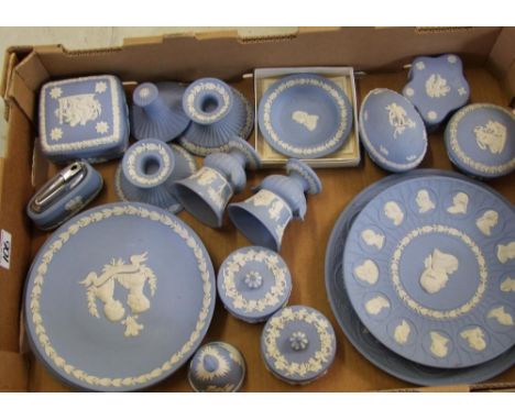 A collection of Wedgwood jasperware: to include plates, lidded boxes, pair of candlesticks, Christmas bell, lighter, candlest