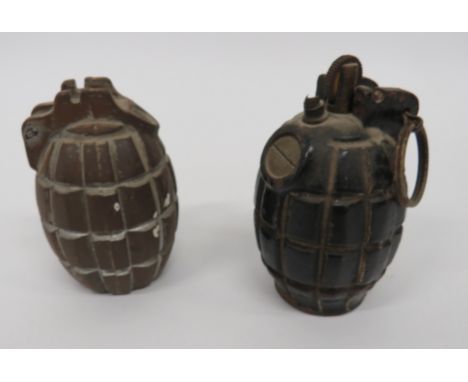 Two Inert Mills Grenades  consisting a No 36 example.  Complete with lever and split pin.  Base plugged.  Now converted into 
