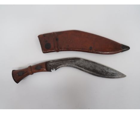 1945 Dated Indian Issue Kukri 12 inch, single edged blade of typical form. Narrow fuller. The forte stamped with maker “GMW” 