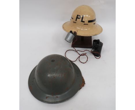 Two Various Civil Defence Steel Helmets  consisting white painted, Zuckerman steel helmet with black painted band with “P.L” 