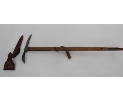 WW2 British Issue Mountain Troops Ice Axe  steel pick and blade marked “Brades 1943” with broad arrow.  Polished, wooden shaf