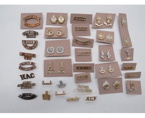 Quantity of Corps Anodised Collar Badges and Titles  collar badges include QC Small Arms School ... QC Intelligence Corps ...