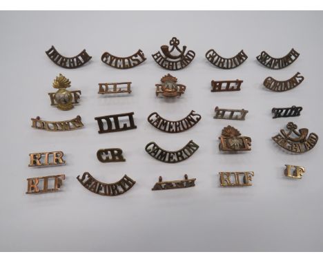 Selection of Infantry Shoulder Titles  brass titles include Durham ... DLI ... HLI ... Highland with strung bugle ... Seafort