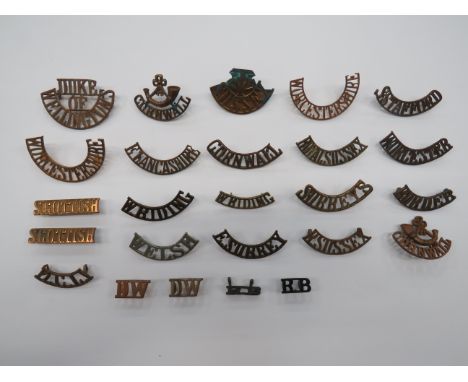 Selection of Infantry Shoulder Titles  brass titles include S Stafford ... VTC Sussex ... Royal Sussex ... R Sussex ... Borde