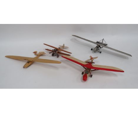 Four Various Pre War Wooden Model Aircraft  consisting a single wing aircraft with rear mounted engine and propellor ... Smal