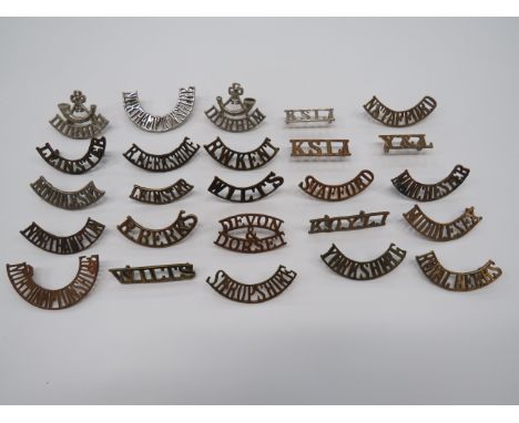 Selection of Infantry Shoulder Titles  brass titles include Leinster ... Devon &amp; Dorset ... Stafford ... Y &amp; L ... Ma