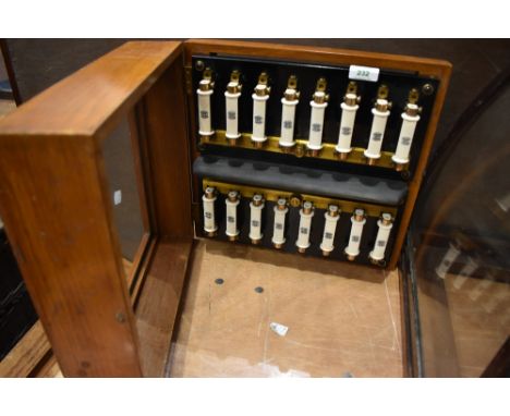 An interesting show cases containibg vintage ceramic fuses , stamped Tucker Telac, England, case approx width 35cm