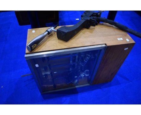 A vintage brewery optic cabinet / cooler and a Guinness beer pump.