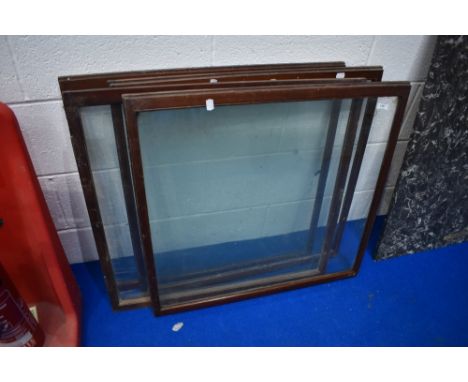 A set of four vintage glazed shop cabinet doors