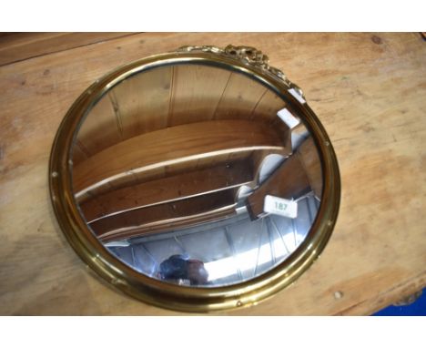 A vintage brass circular wall mirror having convex glass, diameter approx. 34cm
