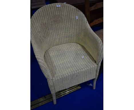 A vintage Lloyd Loom tub chair, in cream