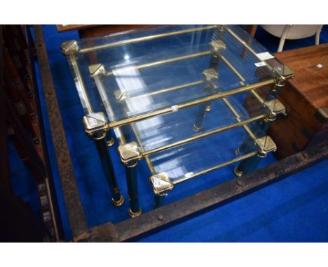 A vintage brass and glass nest of three tables, max dimensions 64 x 40cm, 48cm height