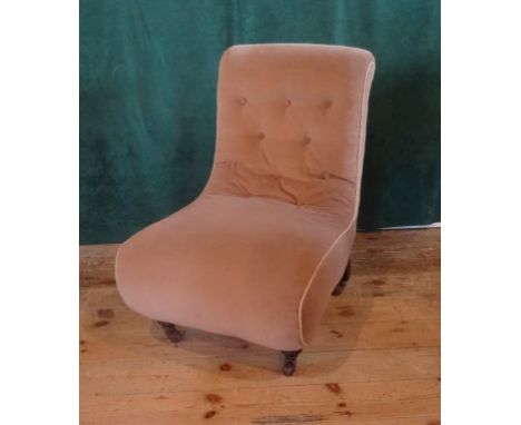 An upholstered button back bedroom chair (53cm wide).