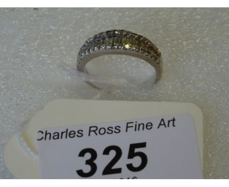 An 18 carat white gold and diamond half-hoop ring, with a central band of graduated baguette diamonds between single cut diam