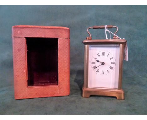 A French gilt brass carriage clock, single barrel movement, five panel bevel edged glass, the enamel dial bearing Roman numer