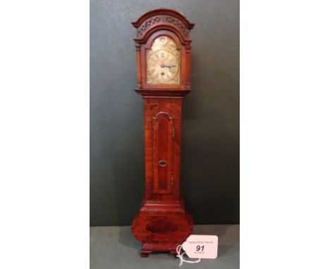 A miniature longcase clock in the 18th century style, with removable broken arched hood and hinged door, the trunk with hinge