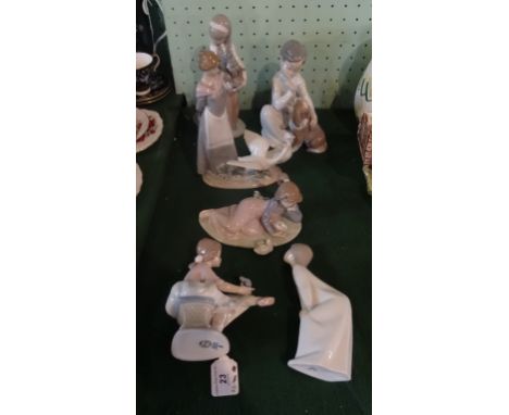 Six Lladro figurines to include examples numbered 4522, 1309, 5659, 5609.