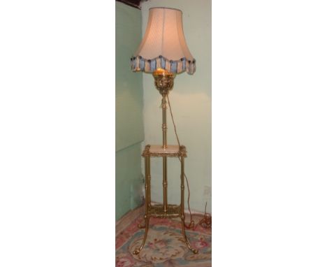 A 20th century brass telescopic standard lamp, manufactured in Germany by The Veritas  Lamps Works, the central column surrou