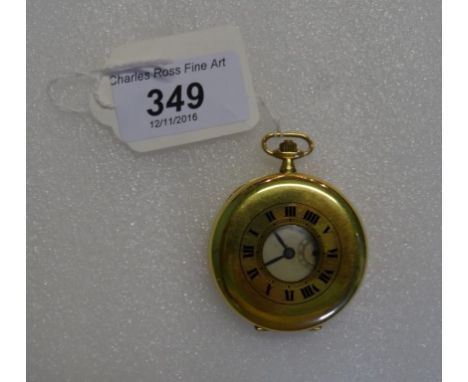 An 18 carat gold cased half hunter pocket watch, the enamel dial bearing Roman numerals, with subsidiary seconds dial at 6 o'