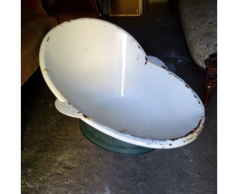 An early 20th century and enamel hip bath.