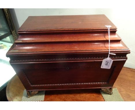 A late Georgian double dome mahogany tea caddy, having twin lift flap and lead lined compartments, mixing bowl recess, red le