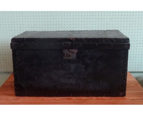 A black painted travelling trunk (76cm x 45cm).
