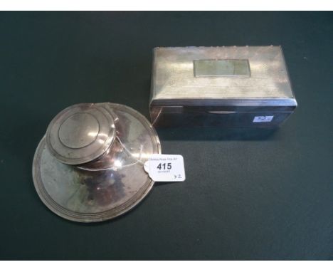 A silver capstan inkwell, Birmingham hallmarks 1910, together with a rectangular silver cigarette box, the lid having engine 