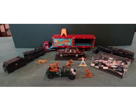 A mixed quantity of toys, to include: a Corgi ERF-KV circus truck and trailer, a model railway engine and trailer, a mini cha