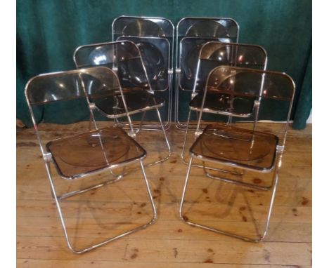 A set of six 1970's Plia chrome and smoked acrylic folding dining chairs. Condition Report: No cracks apparent to the acrylic