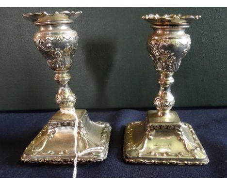 A pair of early 20th century silver squat candlesticks, Birmingham hallmarks 1903 (12cm). Condition Report: Both sticks do no