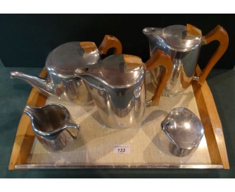 A five piece Picquot Ware tea set and tray. Condition Report: Good overall condition.
Light surface scratches in places.