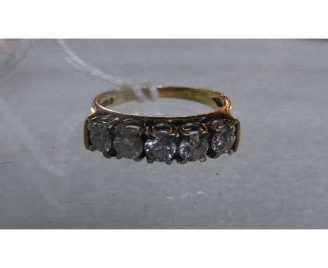 A diamond five stone half hoop ring, the brilliant cut diamonds in raised claw mounts to a plain 18 carat gold shank.