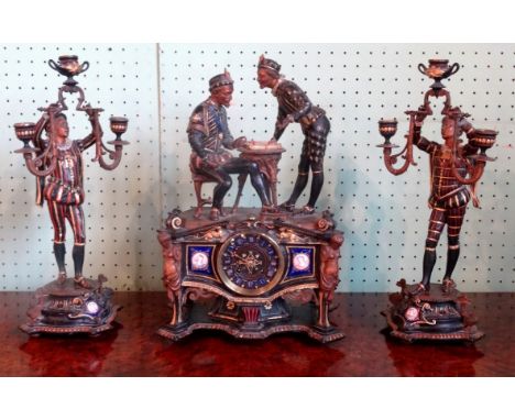 An impressive clock garniture depicting two gentlemen playing chess over a circular enamelled dial signed Paul Cazaux, Vic Fe