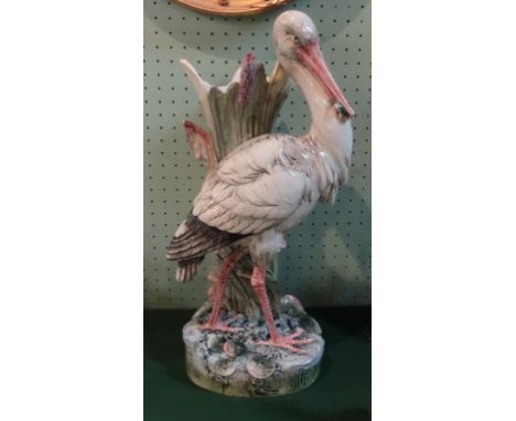 A late 19th century floor standing Majolica umbrella/stick stand, in the manner of Joseph Holdcroft or Minton, a stork beside