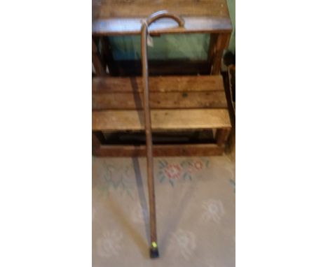 An early to mid-20th century walking stick, fitted with a brass and wood horse measuring stick.