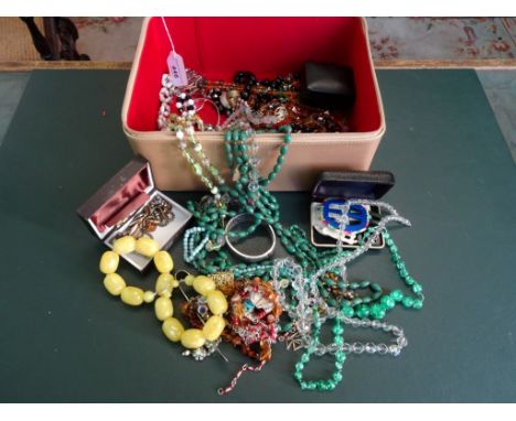 A contemporary Estée Lauder  jewellery case, containing a quantity of costume jewellery, to include: necklaces, belt buckles,