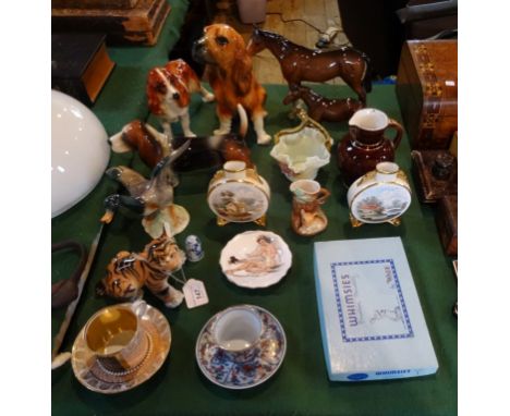 A quantity of animal figures to include: two Beswick horses, Continental ceramic dogs, a Wade Whimsies set no. 2 in original 