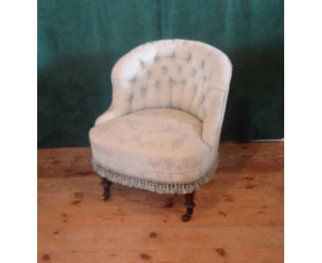 A button back bedroom chair (65cm wide).